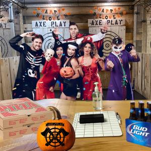 Group in Halloween costumes celebrating at Axe Play Hudson NH