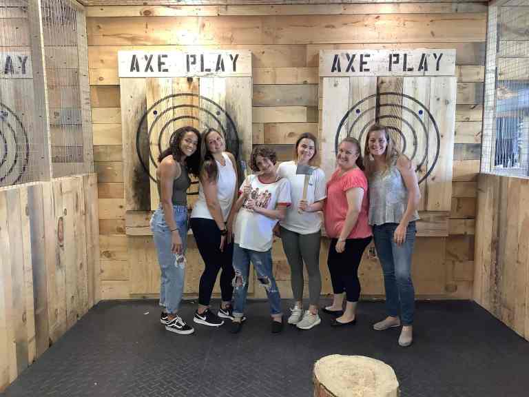 Bachelorette party group posing in lane Axe Play Hudson NH