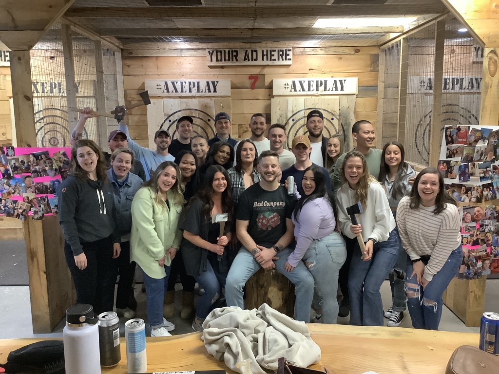 Group of friends posing in an Axe Throwing Lane
