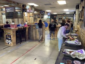 Catering table with platters and trays at Axe Play event in Hudson NH.