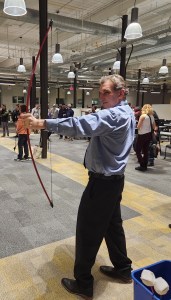 Guest trying Velcro archery at an Axe Play mobile event