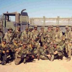 Military unit in desert camo gear during training exercise