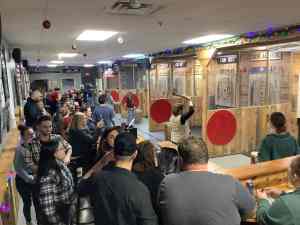 Corporate holiday party group axe throwing at Axe Play Hudson NH