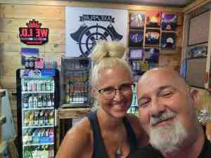 Couple enjoying drinks together during an axe throwing date night