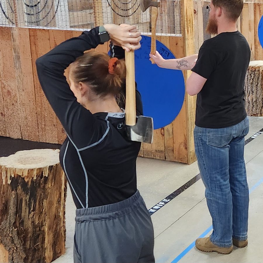 Axe throwing grip showing correct hand placement and relaxed hold for consistent release