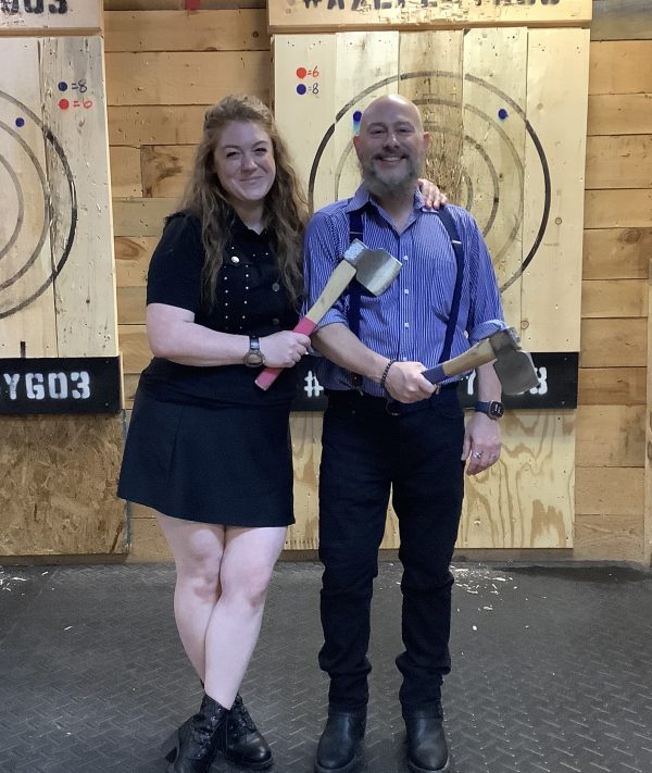 Couple dressed up for a date night axe throwing near Nashua NH