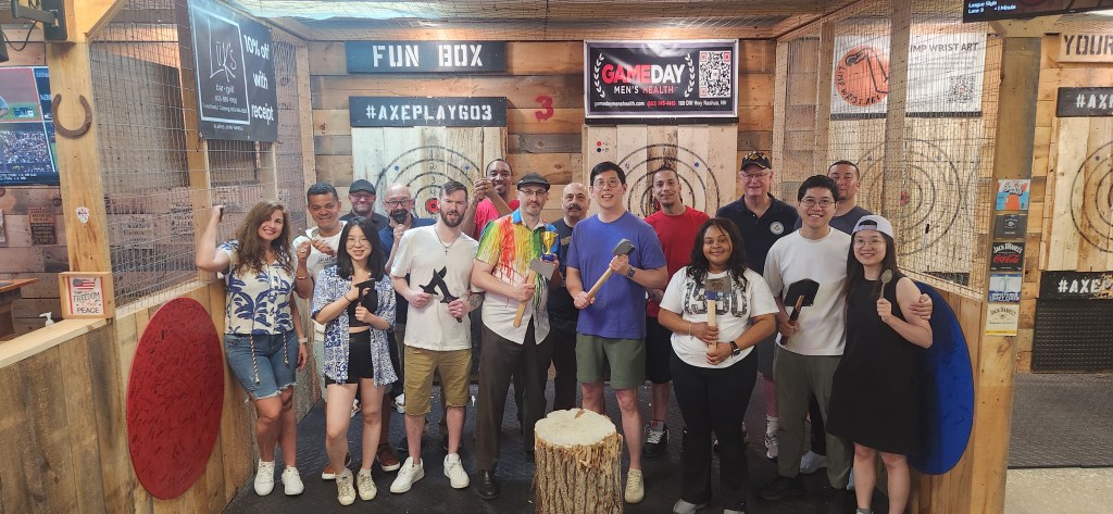 Large group enjoying axe throwing together at Axe Play near Nashua New Hampshire