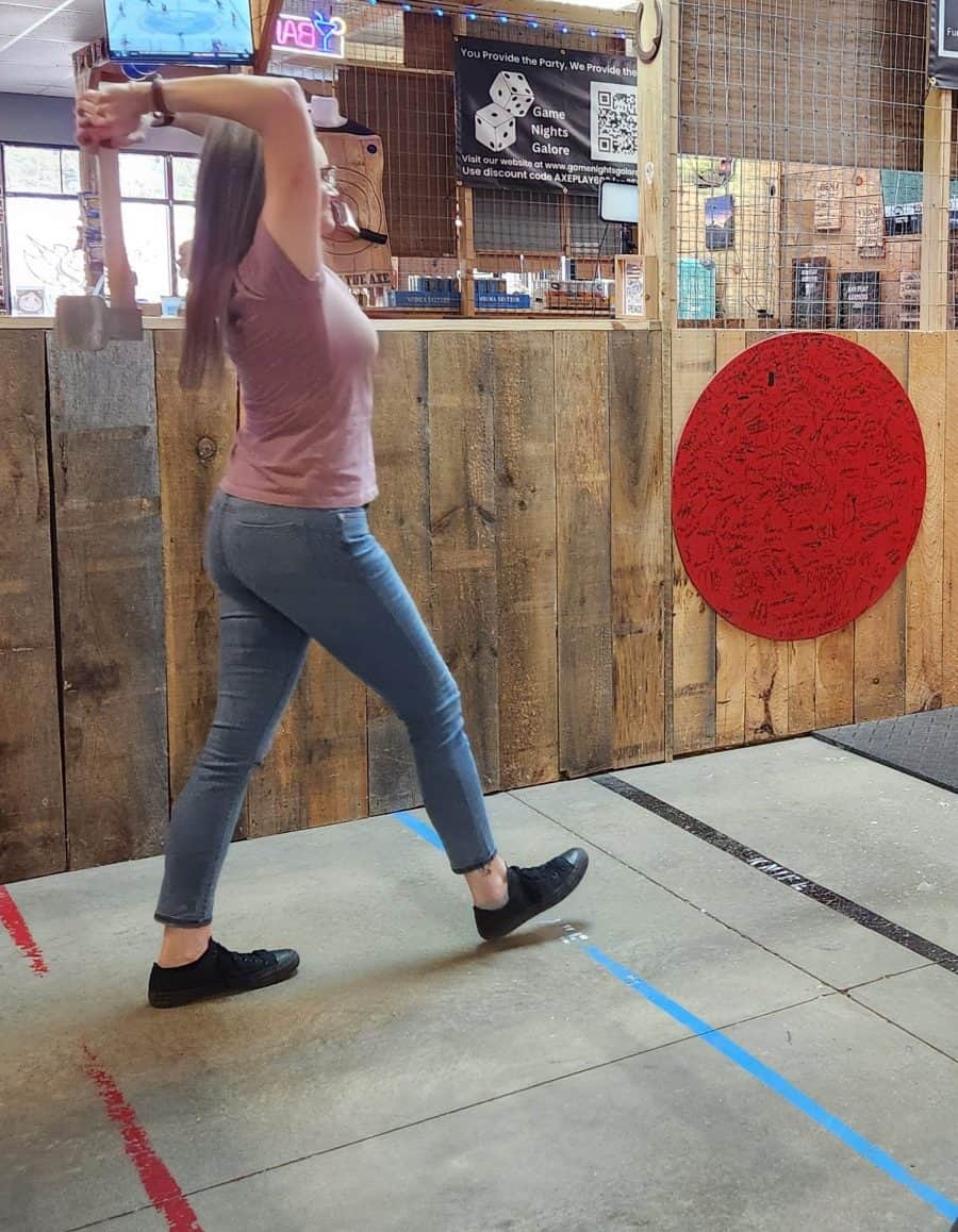 Woman throwing axe during Axepert Challenge at Axe Play NH