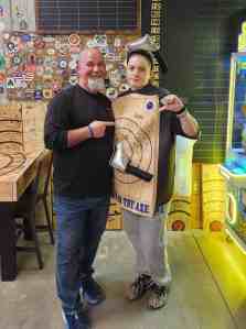 Customer wearing axe throwing loss costume after challenge at Axe Play NH