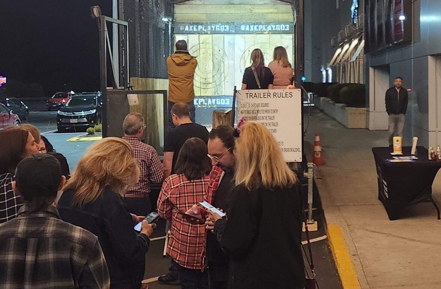 corporate event entertainment nh night axe throwing mobile trailer with large group