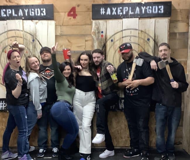Friends enjoying a group axe throwing activity near Nashua NH