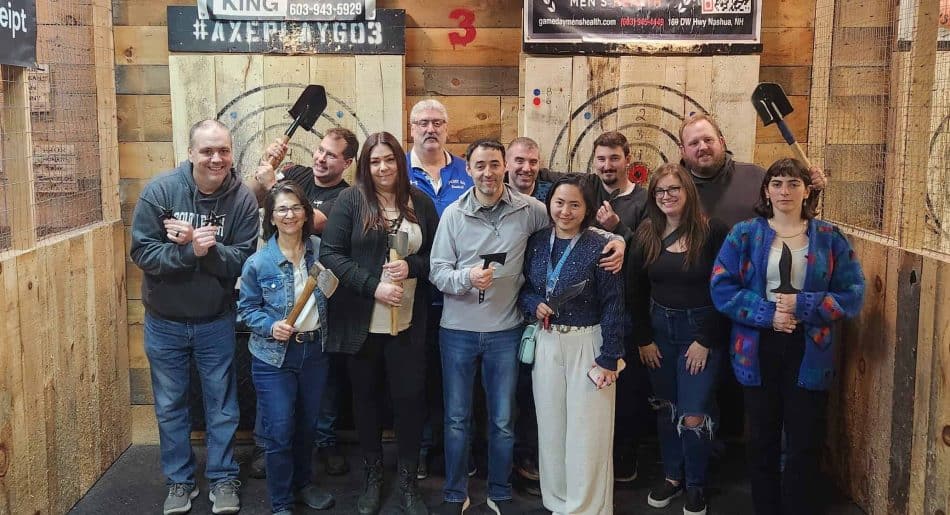 Group enjoying axe throwing at Axe Play in Southern New Hampshire