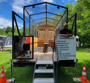 Mobile axe throwing trailer setup in New Hampshire for a private event