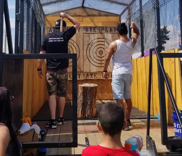 Inside Axe Play mobile axe throwing trailer showing targets and throwing lanes
