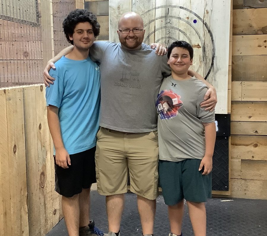 Dad with two kids enjoying Family Day at Axe Play in Hudson NH